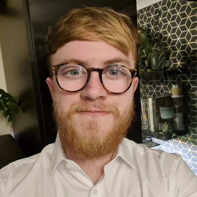 A headshot of Josh Alderman