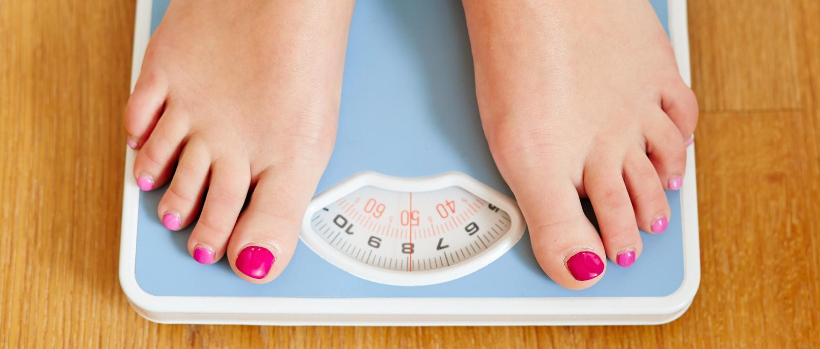 two feet on weighing scales