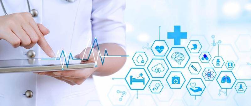 Healthcare professional using tablet with digital medical icons and heartbeat line graphic in blue