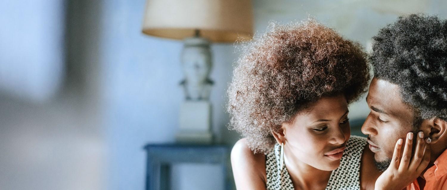 Couple kissing in bed